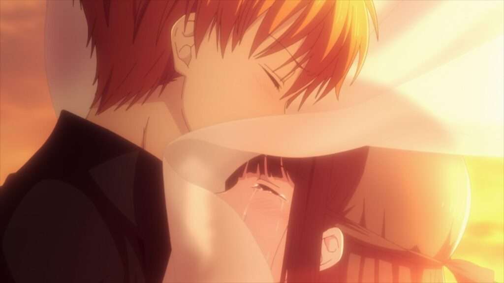 Kyo e Tooru se abraçam ao entardecer em Fruits Basket