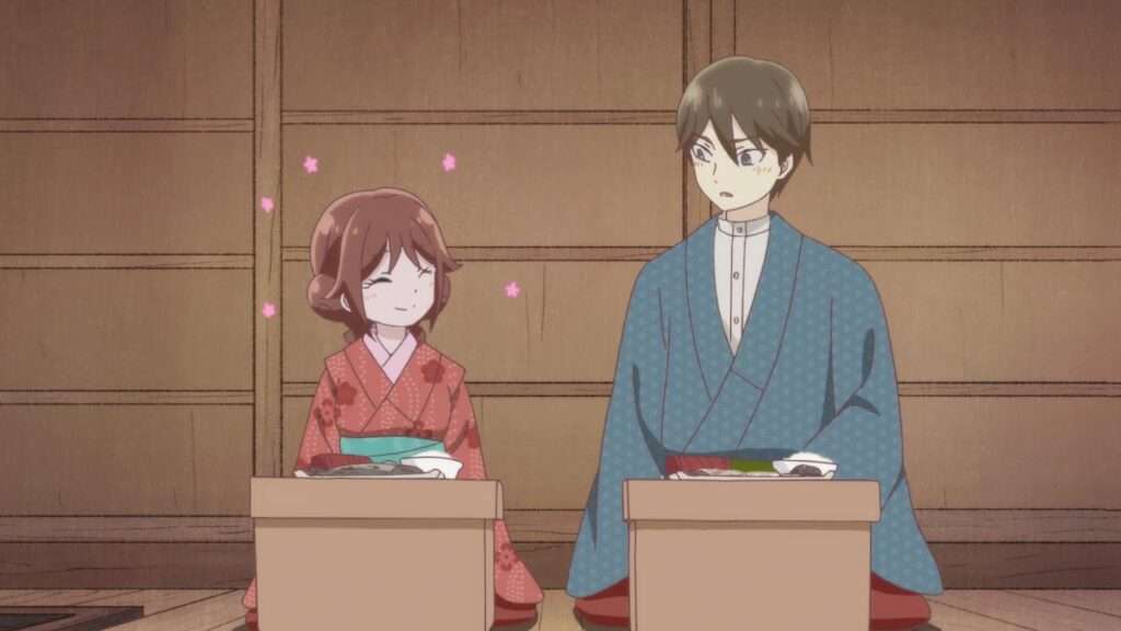 Yuzuki e Tamahiko sentados juntos para comer