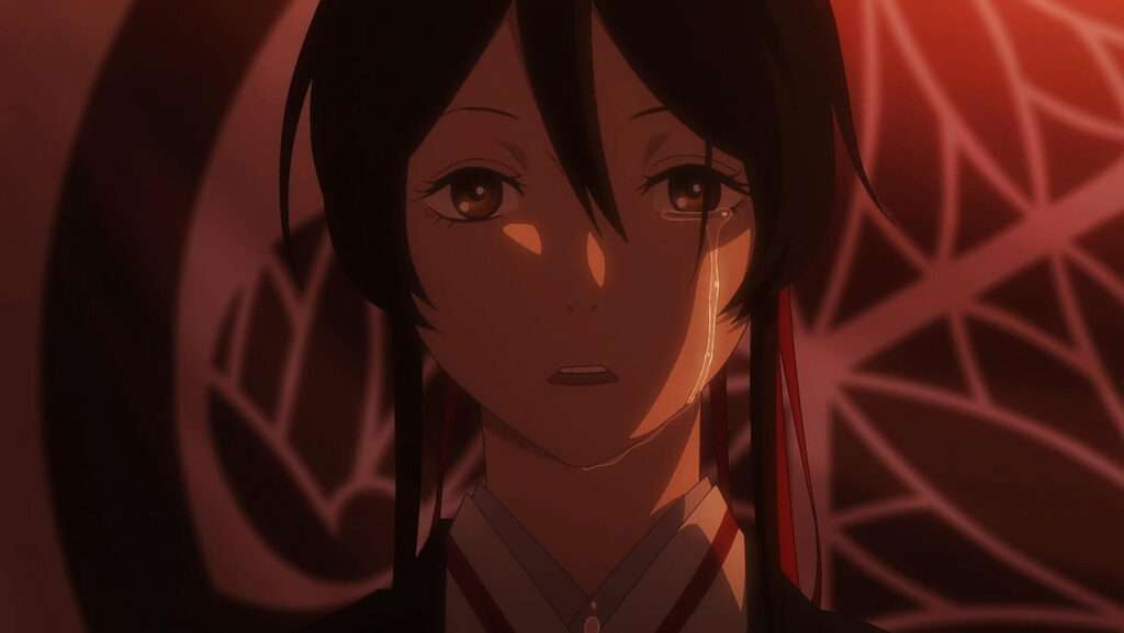 Sagiri, personagem de Hell's paradise que tem cabelos longos pretos presos por uma faixa vermelha e olhos castanhos. Sai uma lágrima de seu olho esquerdo.